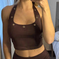 Top con ojalillos